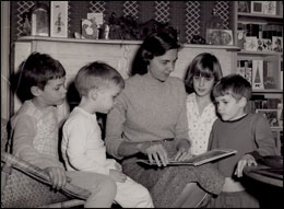 Mother reading to children